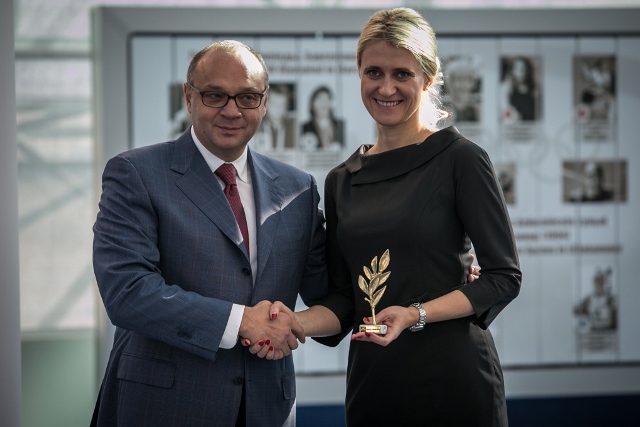 (from left to right)Mr. Igor Yuzefovich, ETU Vice President awards Mrs Nastassia Marynina, for her excellent organizing skills)