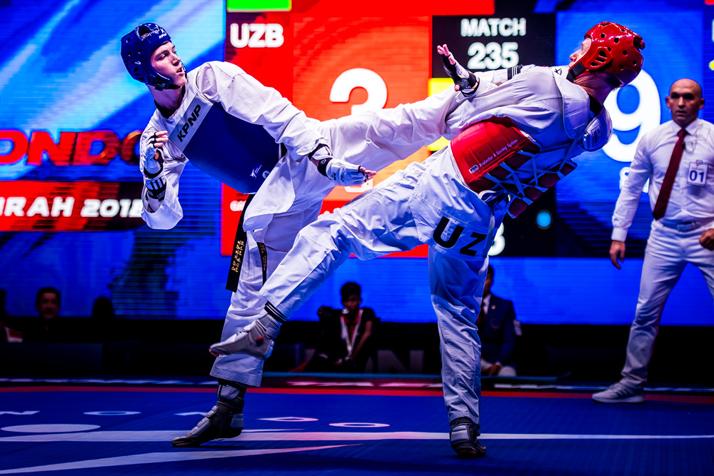 Maksim Khramtcov (left) is attacking oopponent at the Semi Final of -80kg