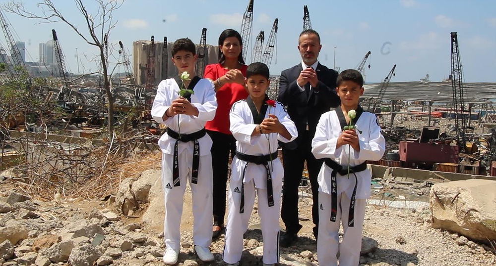 LTF President (right at the back) with taekwondo practitioners at the explosion site